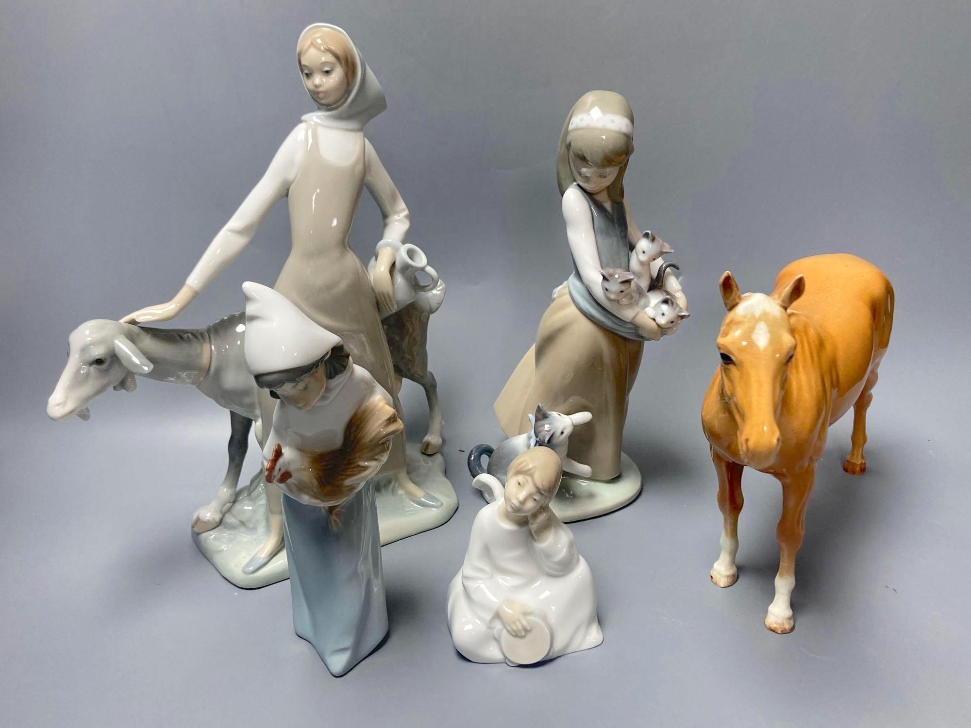 Three Lladro figures, largest 29cm, A Nao seated cherub and a Beswick horse